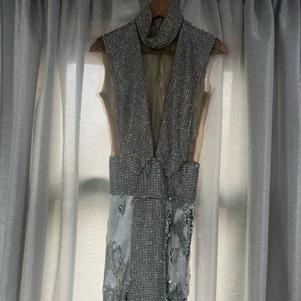 Elegant show stopper dress with a split in the middle of the dress.